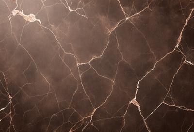 The image features a close-up of a marble wall with a brown and white color scheme. The marble wall has a textured surface, giving it a natural and elegant appearance. The primary subject of the image is the marble wall, which serves as the main object, scene, or focus of the image. The setting or background is the marble wall, and the visual style is a close-up of the marble wall, showcasing its texture and beauty. The colors and mood of the image are predominantly