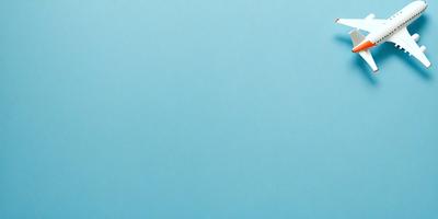 The primary subject of the image is a large, empty blue sky. The setting is a vast, open space with no visible landmarks or objects. The visual style is a natural, outdoor scene with a focus on the sky. The colors and mood are predominantly blue, creating a calm and serene atmosphere.