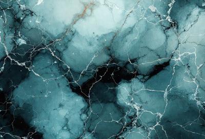 The primary subject of the image is a close-up of a marble surface with a blue and white color scheme. The setting is a room with a blue and white marble wall, which adds to the overall atmosphere. The visual style is a close-up of the marble surface, showcasing its intricate patterns and textures. The colors and mood of the image are predominantly blue and white, creating a serene and elegant ambiance.