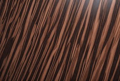 The primary subject of the image is a wooden surface with a patterned design. The setting is a room with a wooden floor, and the visual style is a close-up of the wooden surface. The colors and mood of the image are predominantly brown, giving it a warm and natural atmosphere.