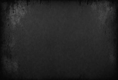 The primary subject of the image is a black and white photo of a wall. The setting is a room with a wall that appears to be made of concrete. The visual style is a black and white photo, which gives the image a classic and timeless appearance. The colors and mood of the image are predominantly dark and moody, with the black and white tones adding to the overall atmosphere.