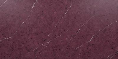 The primary subject of the image is a marble wall with a purple hue. The setting is a room with a marble surface, and the visual style is a close-up of the marble wall. The colors and mood of the image are predominantly purple, giving it a luxurious and elegant appearance.