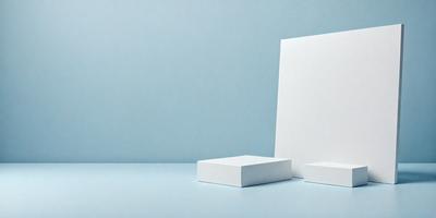 The primary subject of the image is a white box, which is placed on a blue surface. The setting appears to be a studio or workspace, as the box is the main focus of the image. The visual style is a close-up of the white box, which is the only object in the scene. The colors and mood of the image are predominantly blue and white, creating a clean and minimalist atmosphere.