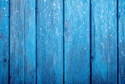 The primary subject of the image is a blue wooden wall with a blue background. The visual style is a photo, and the colors and mood are predominantly blue, creating a calm and serene atmosphere.