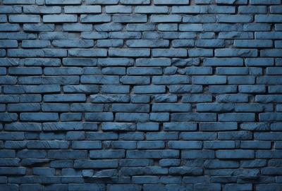 The primary subject of the image is a blue brick wall. The setting is a brick wall, and the visual style is a photo. The dominant colors are blue and gray, creating a calm and serene atmosphere.