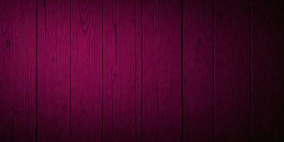 The primary subject of the image is a wooden floor with a red color. The setting is a room with a wooden surface, and the visual style is a close-up of the wooden floor. The dominant colors are red and brown, creating a warm and cozy atmosphere.