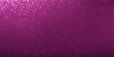 The primary subject of the image is a purple background with a pattern of sparkling stars. The setting is a dark, starry night, and the visual style is a combination of a photo and digital art. The dominant colors are purple and black, creating a moody and dramatic atmosphere.