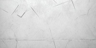 The primary subject of the image is a large, white, textured wall. The setting is a room with a grey background. The visual style is a photo, and the colors and mood are predominantly grey and neutral.