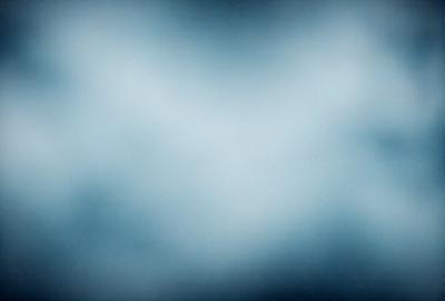 The primary subject of the image is a blue sky with a few clouds. The setting is a cloudy day, and the visual style is a photo. The colors and mood of the image are predominantly blue, creating a calm and serene atmosphere.