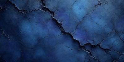 The primary subject of the image is a blue wall with a cracked and chipped appearance. The setting is a room with a blue background. The visual style is a close-up of the wall, showcasing its texture and color. The dominant colors are blue and grey, creating a moody atmosphere.