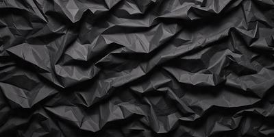 The primary subject of the image is a black and white patterned paper, which is the main object, scene, or focus of the image. The setting is a black background, and the visual style is a photo. The colors and mood of the image are predominantly black and white, giving it a classic and timeless appearance.