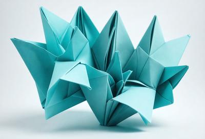 The primary subject of the image is a group of blue origami cranes. They are arranged in a visually appealing manner, creating a sense of harmony and balance. The setting is a white surface, which provides a clean and uncluttered backdrop for the origami cranes. The visual style of the image is a combination of artistic and digital elements, as the cranes are created using a digital art technique. The colors and mood of the image are predominantly blue, which adds a sense