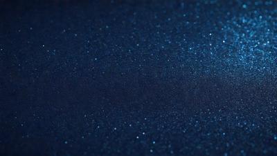 The primary subject of the image is a blue background with a pattern of blue and white stars. The setting is a dark blue sky, and the visual style appears to be a digital art or illustration. The colors and mood of the image are predominantly dark and moody, with the blue and white stars creating a sense of depth and contrast.