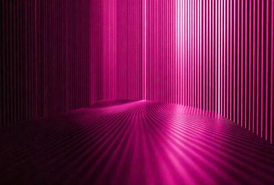 The primary subject of the image is a pink wall with a patterned design. The setting is a room with a pink background, and the visual style appears to be a combination of a photo and digital art. The dominant colors in the image are pink and purple, creating a warm and inviting atmosphere.