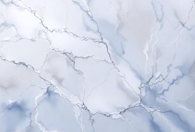 The primary subject of the image is a white marble wall with a blue tint. The setting is a room with a blue tinted wall, and the visual style is a photo. The colors and mood of the image are predominantly blue and white, creating a calm and serene atmosphere.