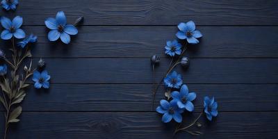 The primary subject of the image is a bouquet of blue flowers, which are arranged in a vase and placed on a wooden table. The setting is a dark blue wooden surface, which serves as the backdrop for the flowers. The visual style of the image is a close-up of the flowers, showcasing their beauty and details. The colors and mood of the image are predominantly dark blue, creating a calm and serene atmosphere.