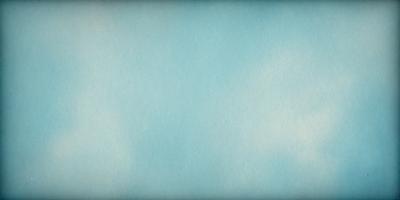 The primary subject of the image is a large, blue, cloudy sky. The setting is a vast, open space with no visible landmarks or objects. The visual style is a natural, outdoor scene with a focus on the sky. The colors and mood are predominantly blue and calm, creating a serene atmosphere.