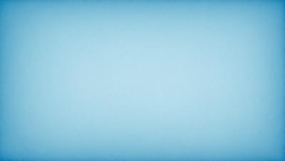 The primary subject of the image is a large, empty blue sky. The setting is a vast, open space with no visible landmarks or objects. The visual style is a natural, untouched landscape. The colors and mood are predominantly blue, creating a serene and peaceful atmosphere.