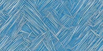 The primary subject of the image is a blue and white patterned surface, which appears to be a textured fabric or a blue and white wallpaper. The setting is indoors, with the patterned surface covering the entire background. The visual style of the image is a close-up of the patterned surface, showcasing the intricate details of the blue and white design. The colors and mood of the image are predominantly blue and white, creating a calm and serene atmosphere.