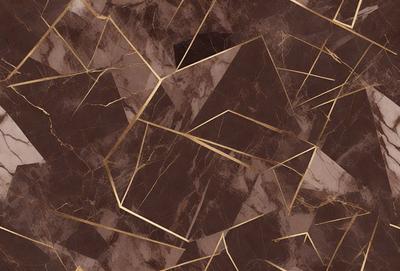 The primary subject of the image is a marble tile with a gold pattern on it. The setting is a wall, and the visual style is a close-up of the tile. The colors and mood of the image are predominantly brown and gold, giving it a warm and luxurious appearance.
