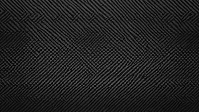 The primary subject of the image is a black and white pattern, which appears to be a digital art or illustration. The setting is a black background, and the visual style is a combination of a photo and a pattern. The colors and mood of the image are predominantly black and white, creating a sense of depth and contrast.