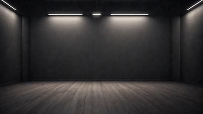 The primary subject of the image is a large, empty room with a black wall. The setting is a dark room with a black background, and the visual style is a black and white photo. The colors and mood of the image are dark and moody, creating a sense of emptiness and solitude.