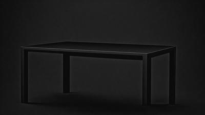 The primary subject of the image is a black table. The setting is a dark room, and the visual style appears to be a photo. The colors and mood of the image are predominantly dark, with the black table being the main focal point.