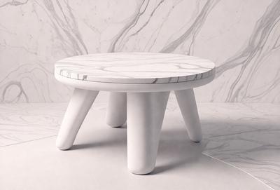 The primary subject of the image is a white marble table with a round top. The table is placed on a white marble floor, which serves as the setting for the scene. The visual style of the image is a photo, capturing the details of the marble table and floor. The colors and mood of the image are predominantly white, giving it a clean and elegant appearance.