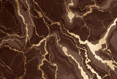 The primary subject of the image is a marble wall with a gold-like pattern. The setting is a room with a brown and gold color scheme. The visual style is a close-up of the marble wall, showcasing the intricate gold-like pattern. The colors and mood of the image are warm and luxurious, evoking a sense of sophistication and elegance.