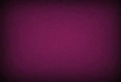The primary subject of the image is a purple background. The setting is a dark, purple room with a wall painted in a deep shade of purple. The visual style is a close-up of the purple wall, which gives a sense of depth and intensity. The colors and mood of the image are predominantly purple, creating a calm and serene atmosphere.