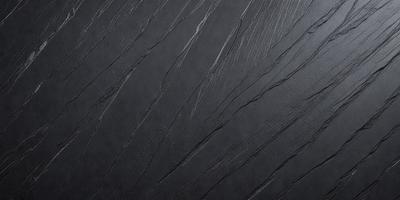 The primary subject of the image is a close-up of a black leather surface, possibly a piece of leather or a leather-like material. The setting is a dark room, and the visual style appears to be a close-up of the leather material. The colors and mood of the image are predominantly dark and moody, with the black leather serving as the main focal point.