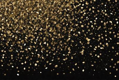 The primary subject of the image is a close-up of gold confetti falling in the air. The setting is a dark background, which contrasts with the bright gold confetti. The visual style is a close-up of the confetti, creating a sense of depth and detail. The colors and mood of the image are predominantly gold and vibrant, creating a lively and festive atmosphere.