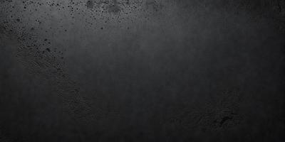 The primary subject of the image is a black background with a few white specks. The setting is a dark room, and the visual style is a black and white photo. The colors and mood of the image are predominantly dark and moody, with the white specks adding a touch of contrast.