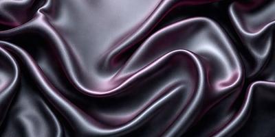 The primary subject of the image is a close-up of a purple fabric, which appears to be a piece of silk. The setting is a dark background, which contrasts with the purple fabric. The visual style is a close-up, focusing on the details of the fabric. The colors and mood of the image are predominantly purple, creating a sense of luxury and elegance.
