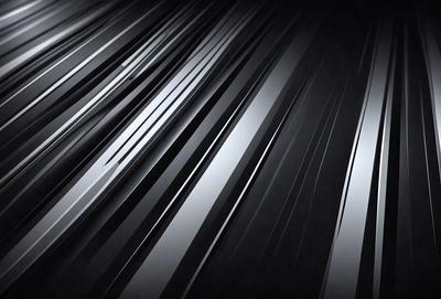 The primary subject of the image is a silver metal surface, which appears to be a metal wall or a metal sheet. The setting is a dark room, and the visual style is a close-up of the metal surface. The colors and mood of the image are predominantly dark, with the silver metal surface being the main focus.