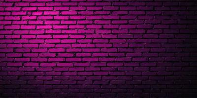 The primary subject of the image is a purple brick wall. The setting is a brick wall, and the visual style is a photo. The dominant colors are purple and pink, creating a warm and inviting atmosphere.