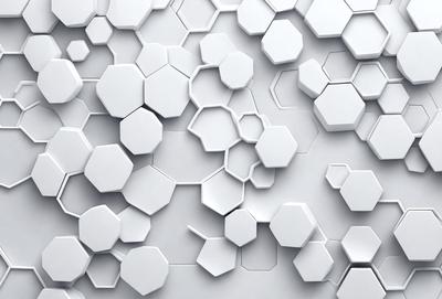 The primary subject of the image is a white wall with a pattern of white hexagons. The setting is a white wall, and the visual style is a photo. The dominant colors are white, and the overall atmosphere is clean and minimalistic.