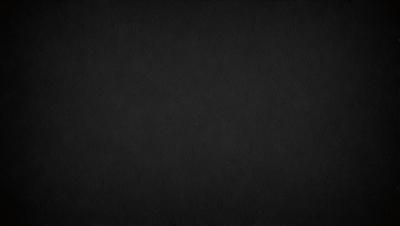 The primary subject of the image is a black background. The setting is a dark, empty space with no visible objects or elements. The visual style is a simple, monochromatic design. The colors and mood are predominantly dark and moody, creating a sense of mystery or drama.