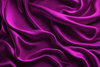 The primary subject of the image is a purple fabric, which is the main object, scene, or focus of the image. The setting or background is a purple curtain, and the visual style is a photo. The colors and mood of the image are predominantly purple, creating a calm and serene atmosphere.