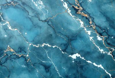 The primary subject of the image is a blue and white marble-like surface, which appears to be a wall or a countertop. The setting is a room with a blue and white color scheme. The visual style is a close-up of the marble surface, showcasing its intricate patterns and textures. The colors and mood of the image are predominantly blue and white, creating a calm and elegant atmosphere.