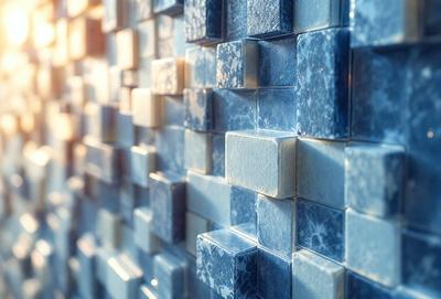 The primary subject of the image is a wall made of blue tiles. The setting is a room with a blue tile wall, and the visual style is a photo. The dominant colors in the image are blue and white, creating a calm and soothing atmosphere.