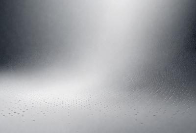The primary subject of the image is a white wall with a pattern of dots on it. The setting is a room with a white background, and the visual style appears to be a photo. The dominant colors are white and gray, creating a clean and minimalist atmosphere.