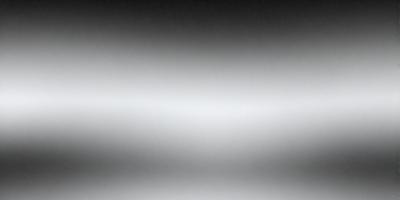 The image is a black and white photo of a white wall. The wall appears to be a canvas, and the photo is taken from a low angle, giving the viewer a unique perspective. The monochromatic color scheme creates a sense of depth and contrast, making the wall stand out as the primary subject of the image.