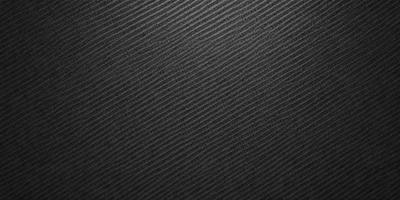 The primary subject of the image is a black and white patterned fabric. The setting is a black background, which contrasts with the patterned fabric. The visual style is a close-up of the fabric, showcasing its intricate design. The colors and mood of the image are predominantly black and white, giving it a classic and timeless appearance.