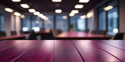 The primary subject of the image is a large wooden table with a purple top. The table is surrounded by multiple chairs, creating a sense of a conference room or a meeting space. The setting is an office environment, with a window visible in the background. The visual style is a photo, capturing the details of the table and chairs. The colors and mood of the image are predominantly purple, giving it a calm and professional atmosphere.