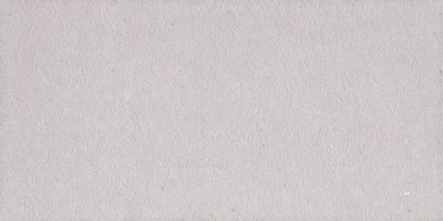 The primary subject of the image is a white wall with a patterned texture. The setting is a room with a white background. The visual style is a close-up of the wall, showcasing the patterned texture. The colors and mood of the image are predominantly white, giving it a clean and minimalist appearance.