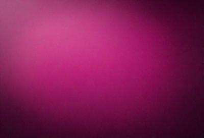 The primary subject of the image is a large, pink wall. The setting is a room with a pink background, and the visual style is a close-up of the wall. The dominant colors in the image are pink, and the overall atmosphere is warm and inviting.