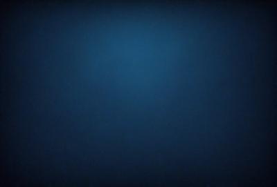 The primary subject of the image is a large, dark blue surface. The setting appears to be a deep, dark ocean, with no visible land or other objects. The visual style of the image is a close-up of the dark blue surface, which gives it a moody and mysterious atmosphere. The colors and mood of the image are primarily dark and subdued, with the blue surface being the dominant color.