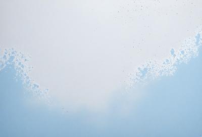 The primary subject of the image is a blue background with white clouds. The setting is a cloudy sky, and the visual style is a photo. The colors and mood of the image are predominantly blue and cloudy, creating a serene and peaceful atmosphere.
