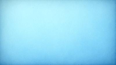 The primary subject of the image is a large, empty blue sky. The setting is a vast, open space with no visible landmarks or objects. The visual style is a natural, outdoor scene with a focus on the sky. The colors and mood are predominantly blue, creating a calm and serene atmosphere.